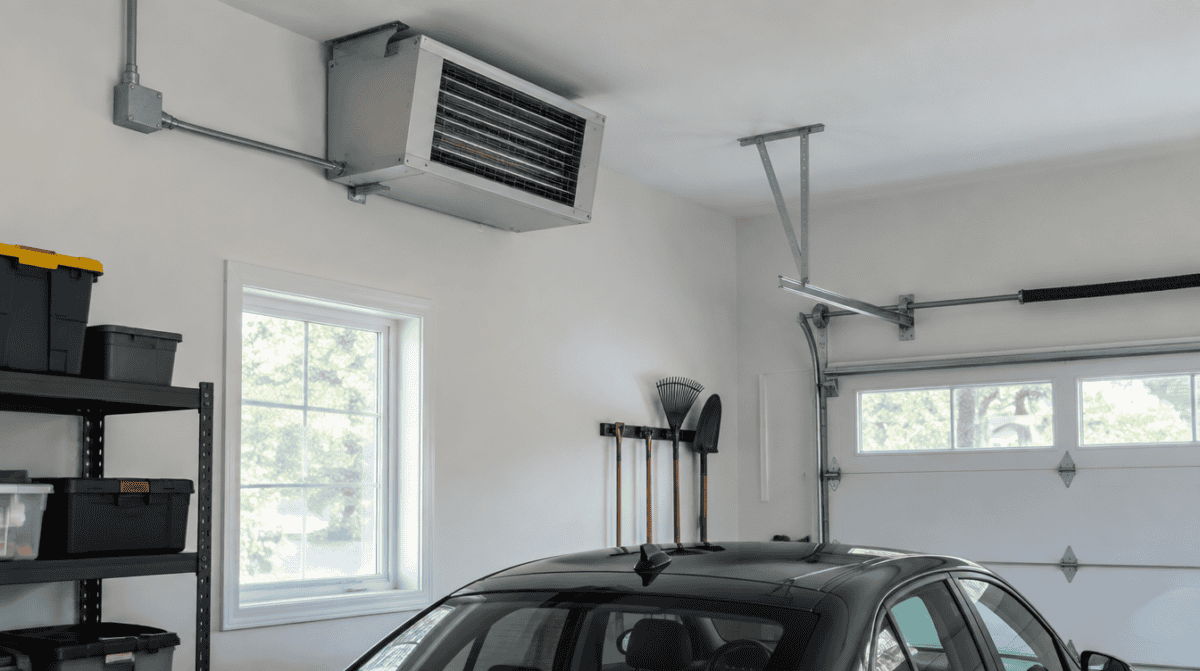 Hardwired electric heater mounted high on a garage wall